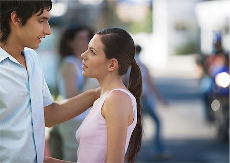 standing downtown - Young couple talking to each other in urban environment Stock Photo - Premium Royalty-Free, Code: 695-05778879