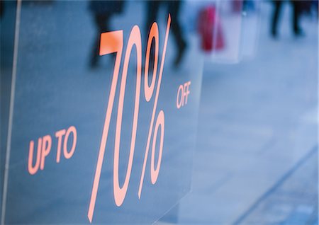 Sign in shop window reading "up to 70% off" Stock Photo - Premium Royalty-Free, Code: 695-05778915
