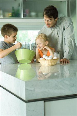 Father cooking with son and daughter Stock Photo - Premium Royalty-Free, Code: 695-05779172