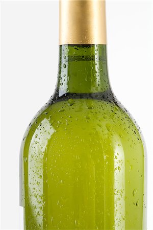 Bottle of white wine covered with drops of water, cropped Stock Photo - Premium Royalty-Free, Code: 695-05779402