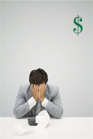 printout - Accountant sitting with adding machine, hiding face in hands Stock Photo - Premium Royalty-Free, Code: 695-05779425