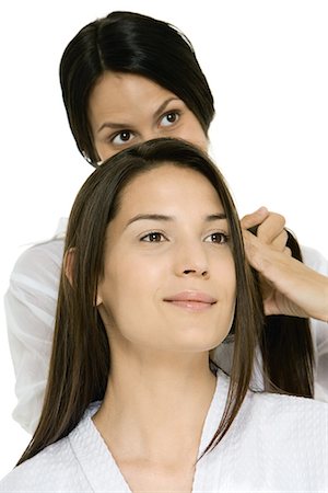 Hair stylist fixing woman's hair Stock Photo - Premium Royalty-Free, Code: 695-05779447