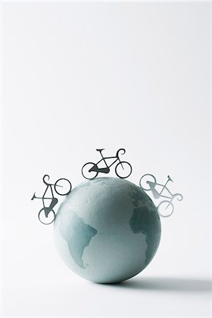 simsearch:695-05779541,k - Bicycles circling globe Stock Photo - Premium Royalty-Free, Code: 695-05779541