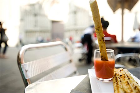 Breadstick dipped in sauce Stock Photo - Premium Royalty-Free, Code: 695-05779750