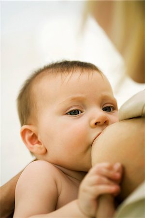 drinking milk with mom - Baby breastfeeding, close-up Stock Photo - Premium Royalty-Free, Code: 695-05779795