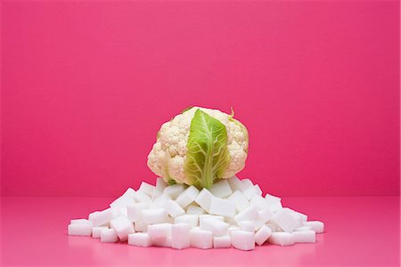 Food concept, fresh cauliflower on top of pile of sugarcubes Stock Photo - Premium Royalty-Free, Code: 695-05779896