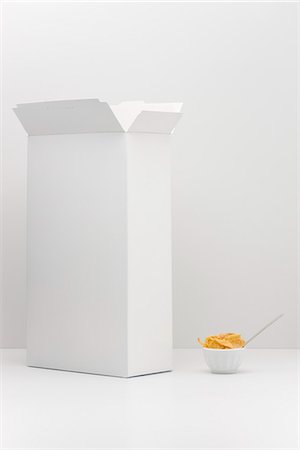 portion - Food concept, cereal box with small bowl of cereal Stock Photo - Premium Royalty-Free, Code: 695-05779905