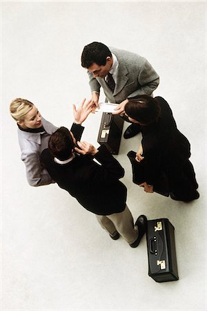 Business associates standing together having discussion, high angle view Stock Photo - Premium Royalty-Free, Code: 695-05770000