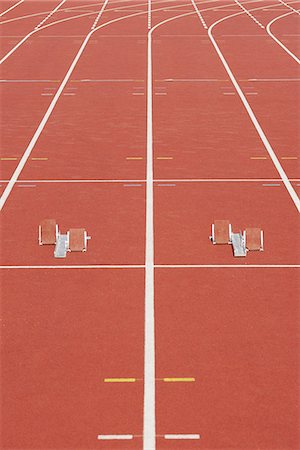 simsearch:695-05770085,k - Starting blocks on running track Fotografie stock - Premium Royalty-Free, Codice: 695-05770085