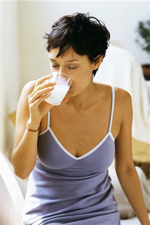 Woman drinking glass of milk Fotografie stock - Premium Royalty-Free, Codice: 695-05770115