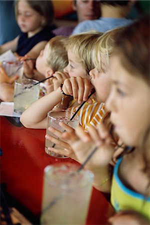 Children at snack-time Stock Photo - Premium Royalty-Free, Code: 695-05770116