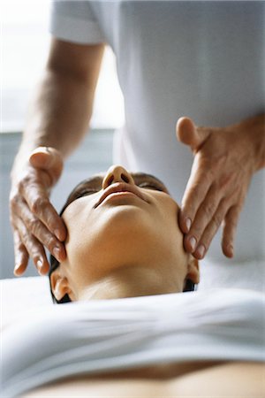 face treatment - Woman receiving head massage Stock Photo - Premium Royalty-Free, Code: 695-05770239