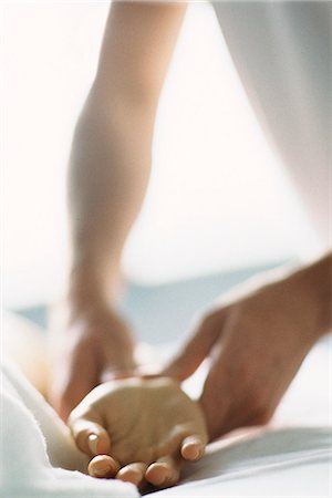 reflexology - Therapist treating patient's wrist, cropped Stock Photo - Premium Royalty-Free, Code: 695-05770267