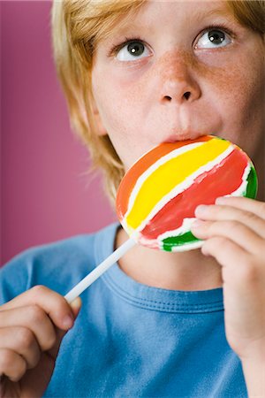 freckled boy - Boy eating lollipop Stock Photo - Premium Royalty-Free, Code: 695-05770285