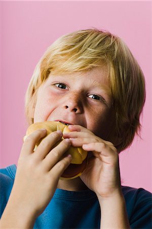 people eating bagels - Boy eating sandwich Stock Photo - Premium Royalty-Free, Code: 695-05770282