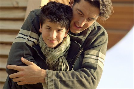 simsearch:695-03385136,k - Father embracing son, boy smiling at camera Stock Photo - Premium Royalty-Free, Code: 695-05770578