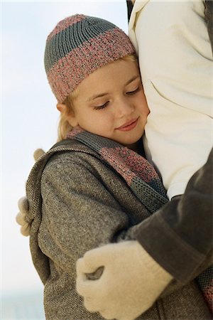 simsearch:633-05401631,k - Little girl embracing parent, looking down Stock Photo - Premium Royalty-Free, Code: 695-05770572