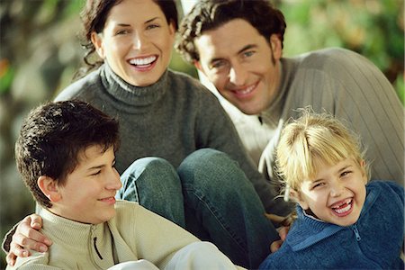 Family laughing together outdoors Stock Photo - Premium Royalty-Free, Code: 695-05770585