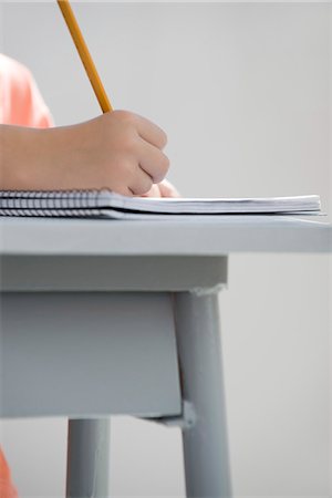Young student writing in notebook, cropped Foto de stock - Royalty Free Premium, Número: 695-05770729
