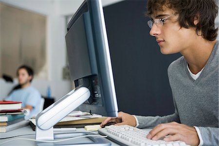 College student using computer in classroom Stock Photo - Premium Royalty-Free, Code: 695-05770796