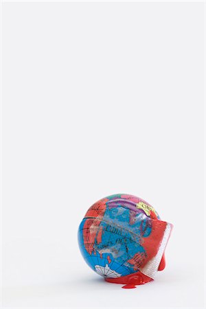 Adhesive bandage soaked in blood wrapped around globe Stock Photo - Premium Royalty-Free, Code: 695-05770881