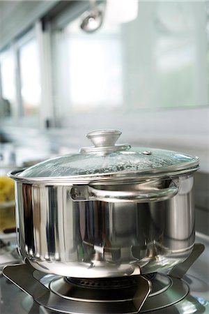 stainless steel stove top - Pot cooking on stove Stock Photo - Premium Royalty-Free, Code: 695-05770929