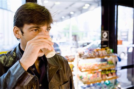 picture variety store - Man drinking coffee in convenience store Stock Photo - Premium Royalty-Free, Code: 695-05770994