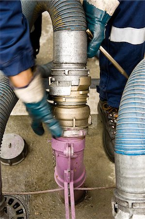 pipes workers - Preparing to fill gas station fuel storage tanks Stock Photo - Premium Royalty-Free, Code: 695-05771054