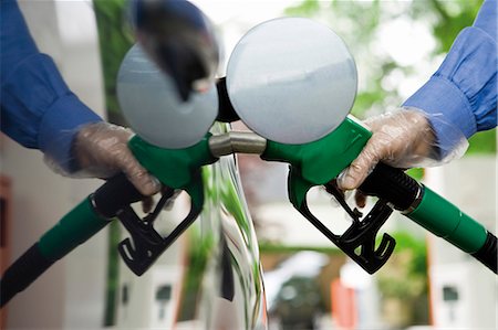 petrol & gas photos - Refueling vehicle at gas station Stock Photo - Premium Royalty-Free, Code: 695-05771073