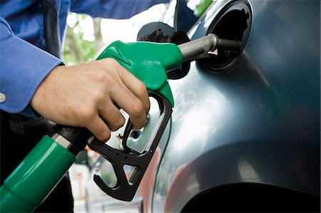 petrol & gas photos - Refueling vehicle at gas station Stock Photo - Premium Royalty-Free, Code: 695-05771081