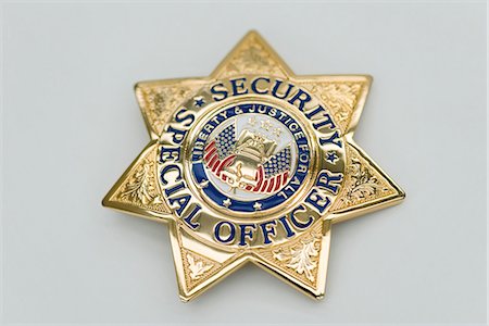 simsearch:695-03387008,k - Special Security Officer brass badge Foto de stock - Sin royalties Premium, Código: 695-05771193