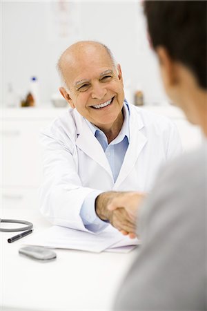 friendly - Doctor shaking patient's hand Stock Photo - Premium Royalty-Free, Code: 695-05771237
