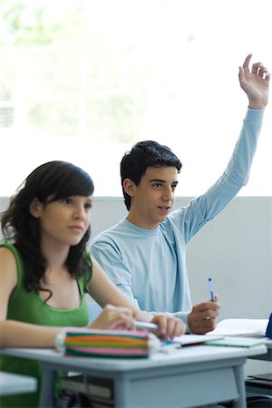 students in class raising hands - High school students in class, teen boy raising hand Stock Photo - Premium Royalty-Free, Code: 695-05771378