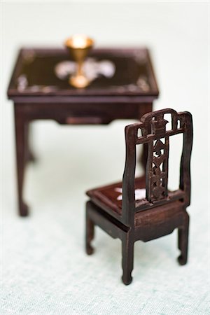 fake - Miniature chair and table Stock Photo - Premium Royalty-Free, Code: 695-05771445