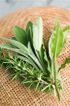 Fresh sage, rosemary, and bay leaves Stock Photo - Premium Royalty-Free, Code: 695-05771556