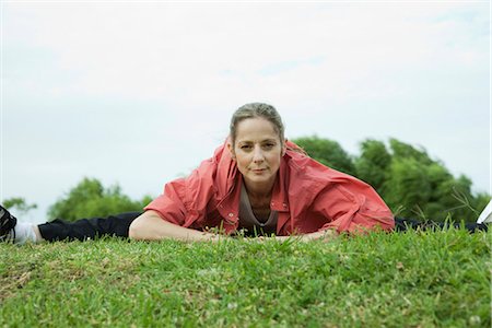 sits on a splits - Mature woman stretching in park Stock Photo - Premium Royalty-Free, Code: 695-05771578