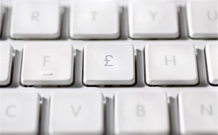 Great Britain Pound symbol on laptop computer keyboard Foto de stock - Sin royalties Premium, Código: 695-05771641