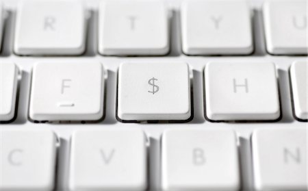 American dollar sign on laptop computer keyboard Stock Photo - Premium Royalty-Free, Code: 695-05771642