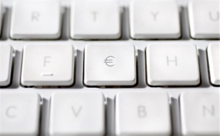 symbol (concept) - Euro sign on laptop computer keyboard Stock Photo - Premium Royalty-Free, Code: 695-05771643