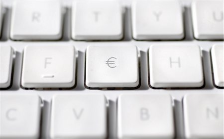 Euro sign on laptop computer keyboard Stock Photo - Premium Royalty-Free, Code: 695-05771643