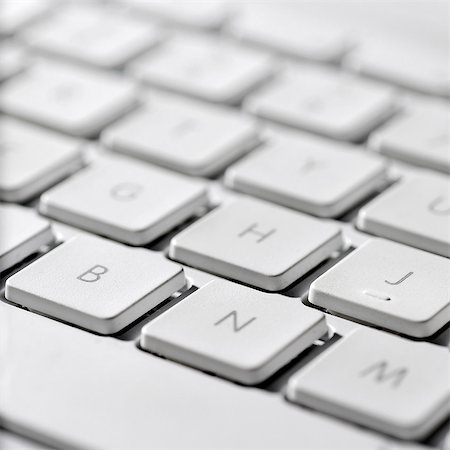 semejanza - Close-up of keys on a laptop computer keyboard Foto de stock - Sin royalties Premium, Código: 695-05771660