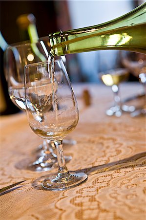 stemware - Pouring glass of white wine Stock Photo - Premium Royalty-Free, Code: 695-05771696