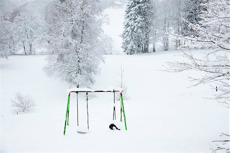 playground not person not model released - Snow-covered swingset Stock Photo - Premium Royalty-Free, Code: 695-05771816