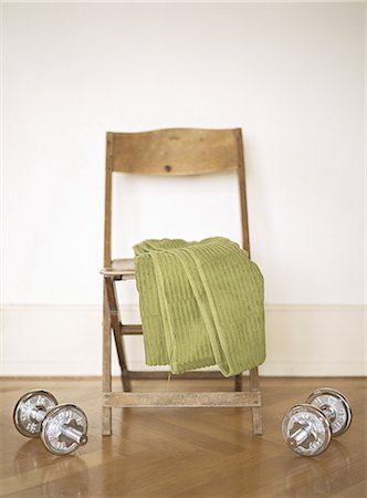 simsearch:614-06442547,k - Barbells on floor next to chair with towel Stock Photo - Premium Royalty-Free, Code: 695-05772015