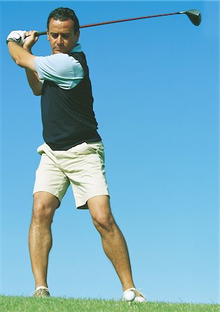 simsearch:649-06305707,k - Golfer swinging club Stock Photo - Premium Royalty-Free, Code: 695-05772125