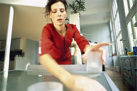 simsearch:695-05772228,k - Woman cleaning table Stock Photo - Premium Royalty-Free, Code: 695-05772211