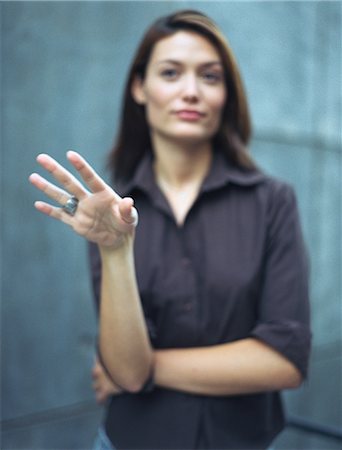 Woman gesturing, defocused Stock Photo - Premium Royalty-Free, Code: 695-05772452