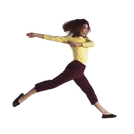 Woman jumping Stock Photo - Premium Royalty-Free, Code: 695-05772622