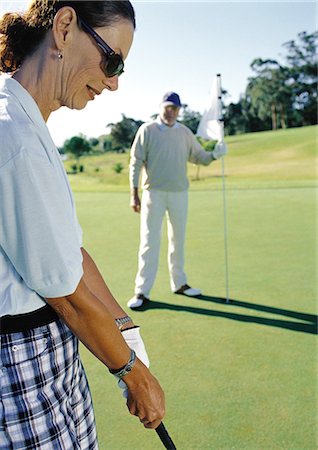 recreational sports league - Mature couple playing golf Stock Photo - Premium Royalty-Free, Code: 695-05772709