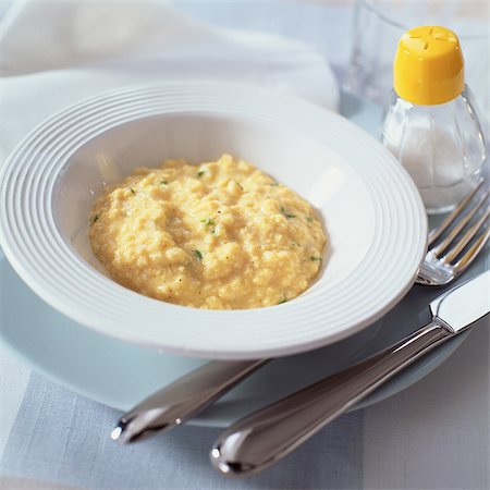 risotto - Bowl of creamy cheese risotto with herbs Stock Photo - Premium Royalty-Free, Code: 695-05773142